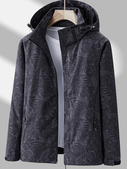 Leonor | Chaqueta Cortavientos con Capucha y Estampado de Hojas - StilfulltWomen's jacketsUKIXMHIKNegroXSLeonor | Chaqueta Cortavientos con Capucha y Estampado de Hojas