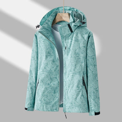 Leonor | Chaqueta Cortavientos con Capucha y Estampado de Hojas - StilfulltWomen's jacketsQVAOCNRZTurquesaXSLeonor | Chaqueta Cortavientos con Capucha y Estampado de Hojas